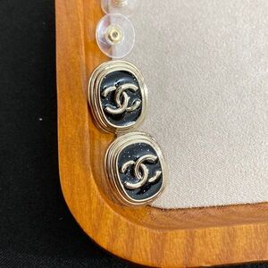 CHANEL Elegant Black and Gold Logo Earrings
